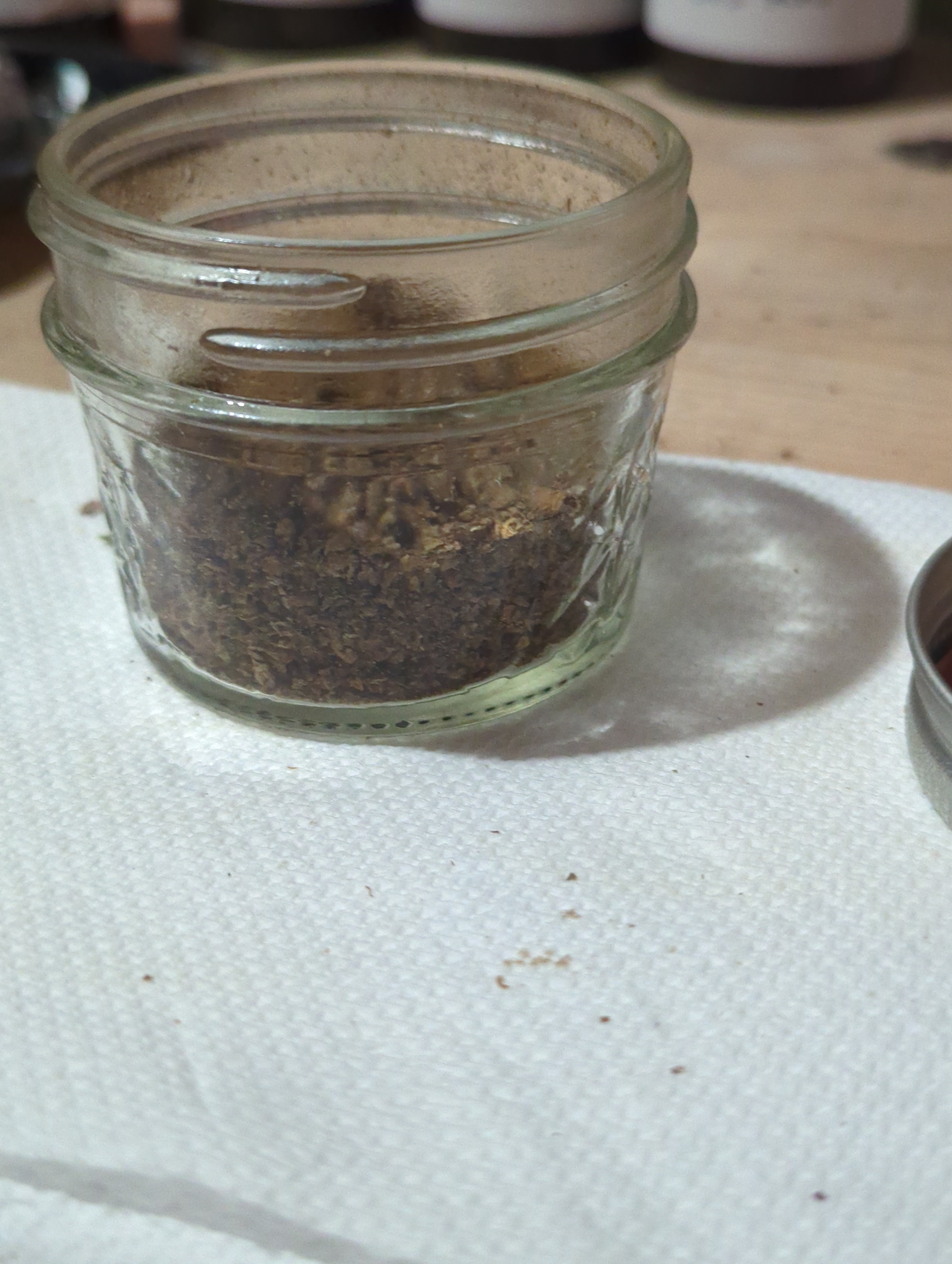 already vaped bud in a 4 ounce mason jar. it is half-full