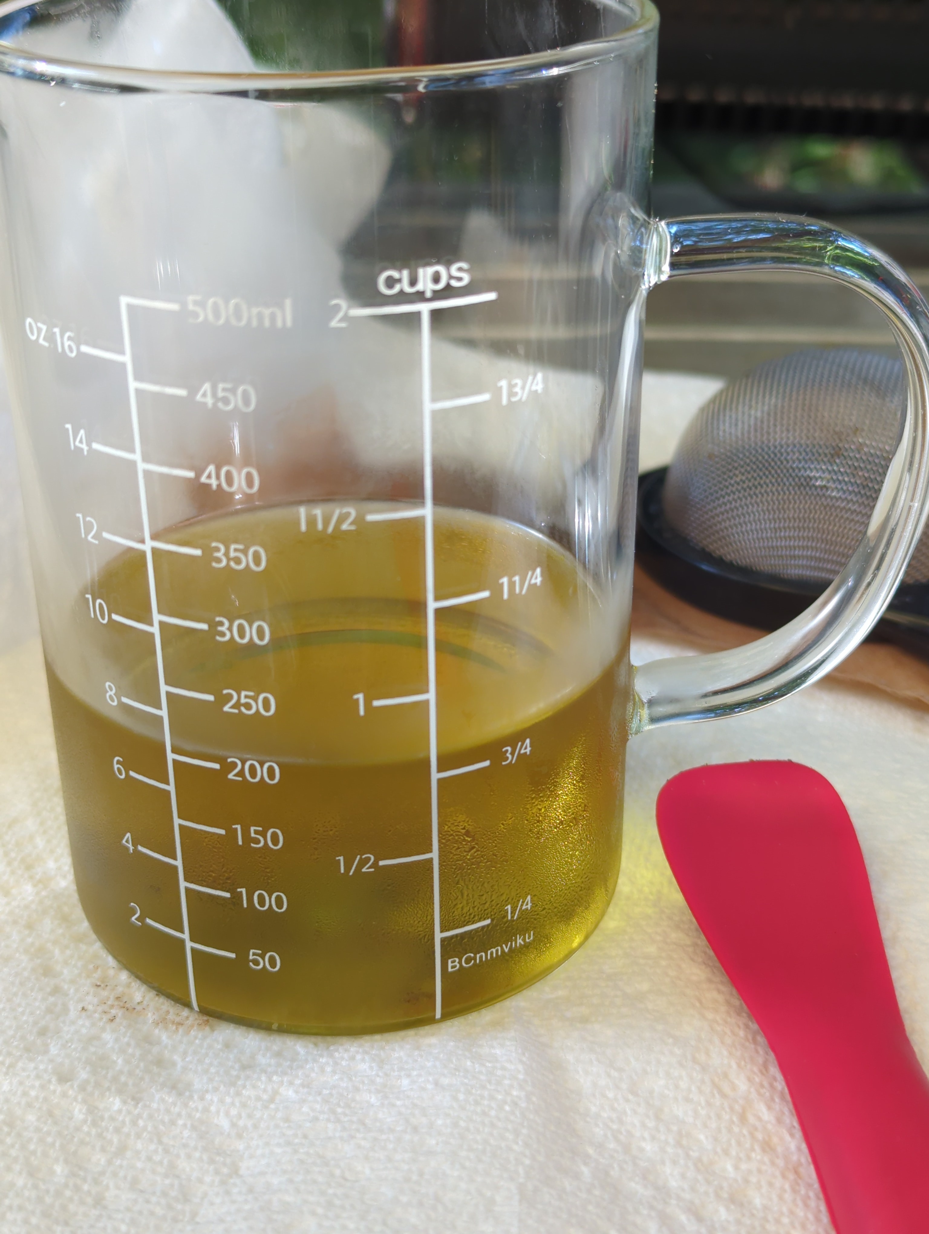 just under 1 cup of strained solvent. it is a rich golden color